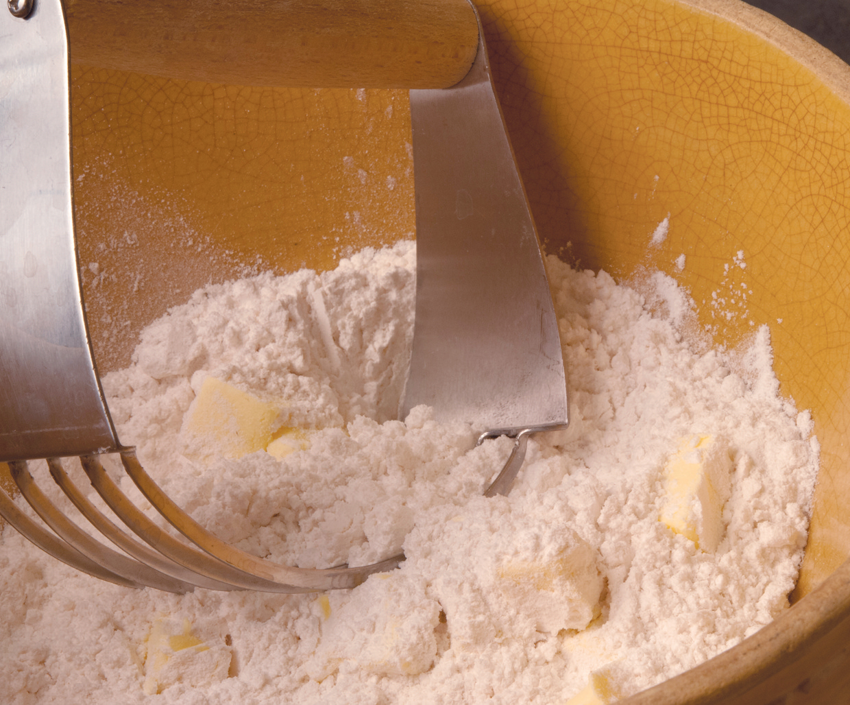 stirring flour and butter in a bowl