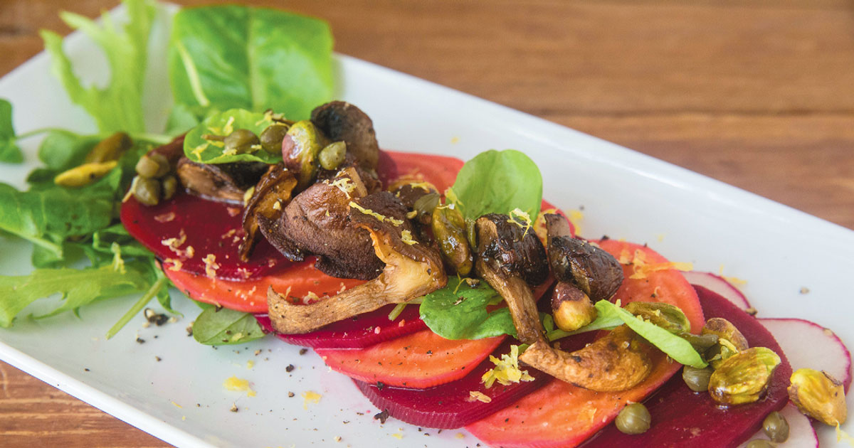 Beet salad with tomato and mushrooms
