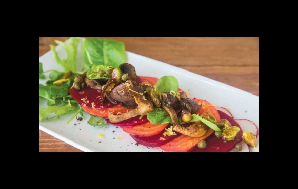 Beet Carpaccio with Roasted Mushrooms, Capers, Pistachio, Radish and Baby Greens